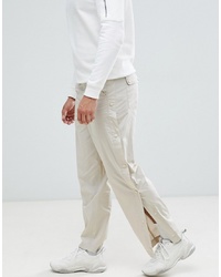 ASOS DESIGN Relaxed Trousers In Beige With Side Poppers