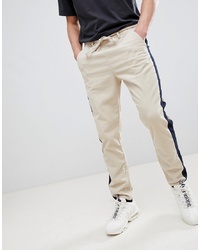 ASOS DESIGN Tapered Trousers In Putty Cord With Navy