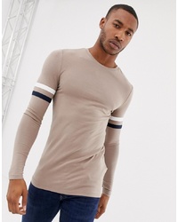 ASOS DESIGN Muscle Fit Longline Long Sleeve T Shirt With Contrast Sleeve Stripe In Beige