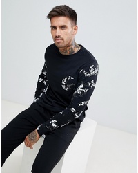 ASOS DESIGN Long Sleeve T Shirt With Contrast Floral Sleeve And Pocket