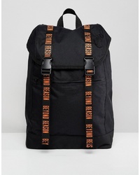 ASOS DESIGN Hiker Backpack In Black With Orange Beyond Reason Slogan Taping