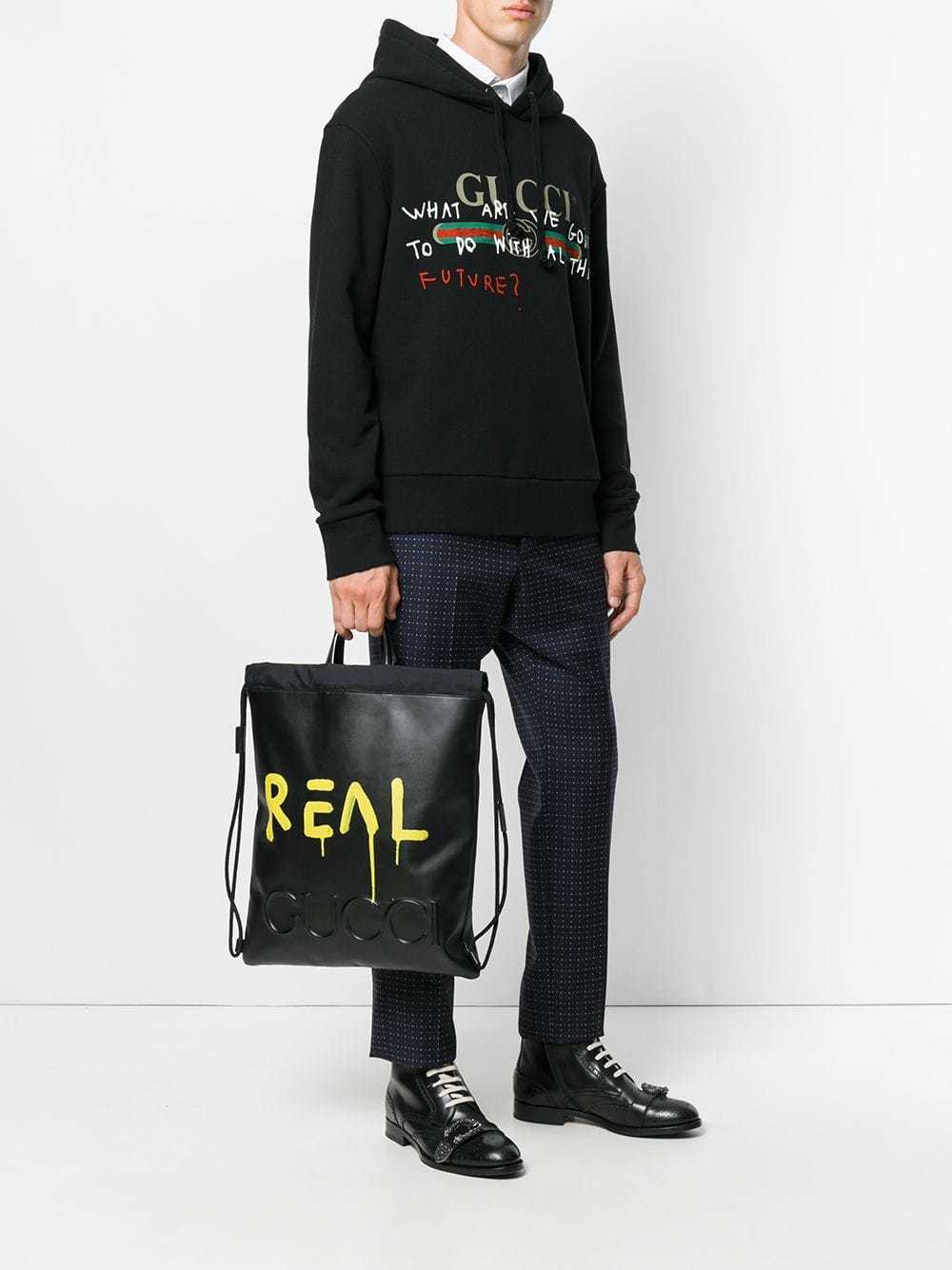 Gucci Ghost Drawstring Backpack, $1,583 | farfetch.com | Lookastic