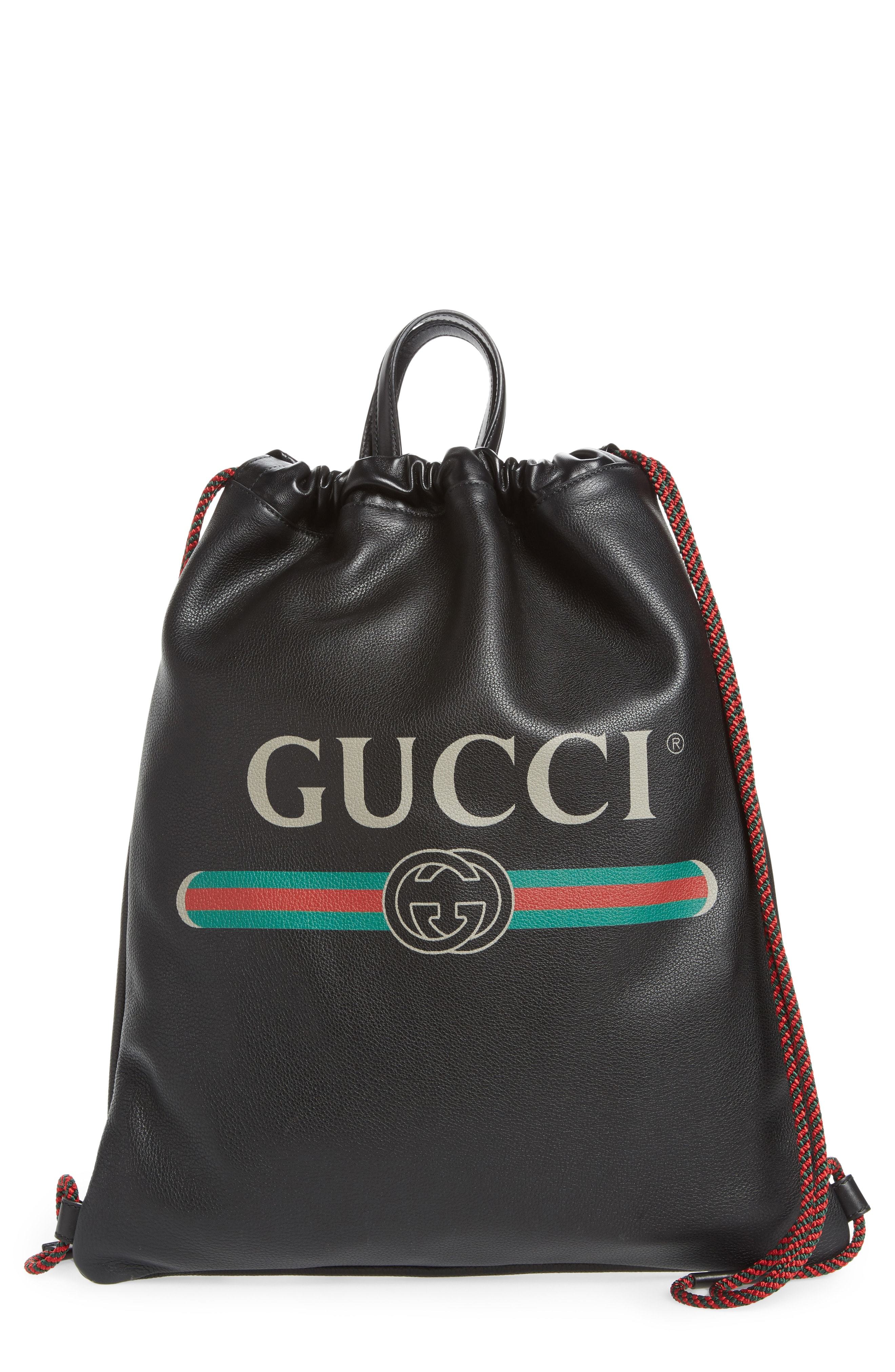 gucci print leather drawstring backpack