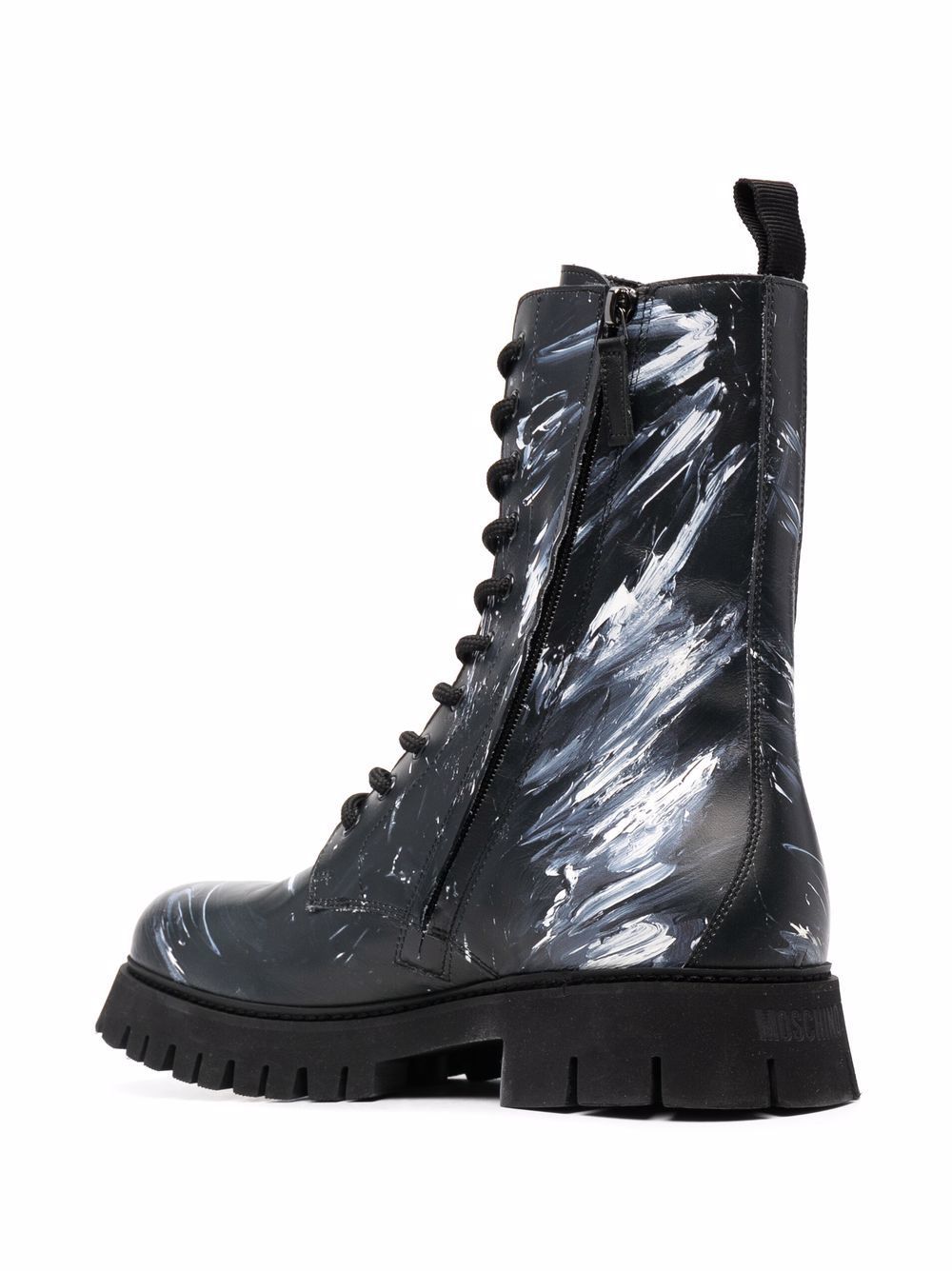 Moschino Paint Splatter Combat Boots, $418 | farfetch.com | Lookastic