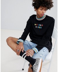 ASOS DESIGN Relaxed Long Sleeve T Shirt With Rainbow Contrast Rib And No Bad Vibes Slogan Print
