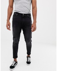 Bershka Carrot Fit Jeans In Black With Rips And Hem Taping