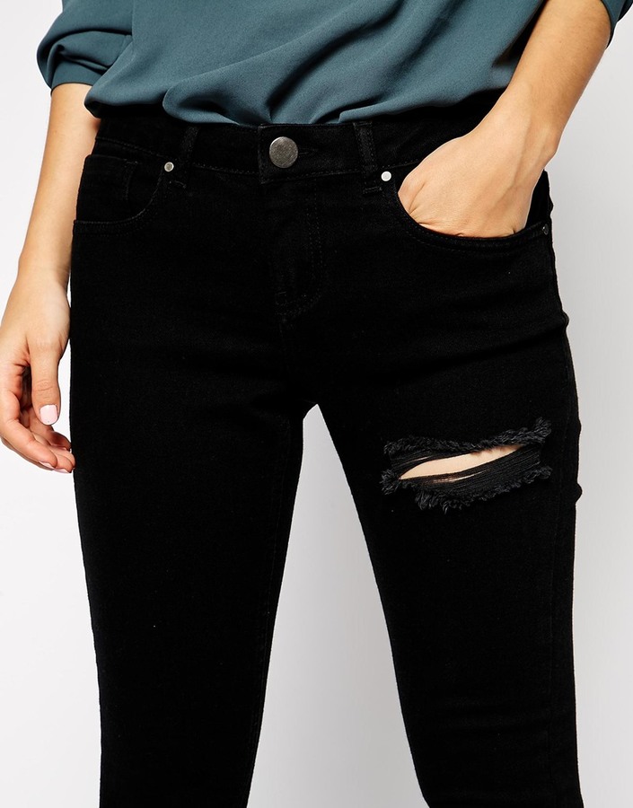 Asos Petite Whitby Low Rise Skinny Jeans In Clean Black With Thigh Rip