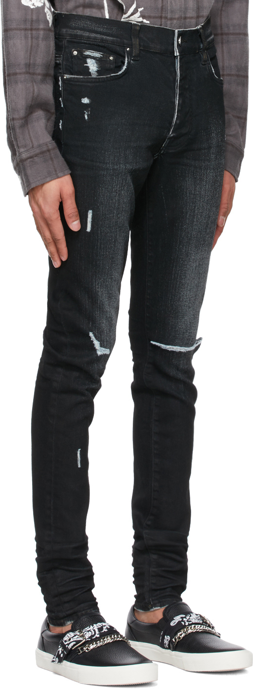 Amiri Black Slit Knee Jeans, $790 | SSENSE | Lookastic