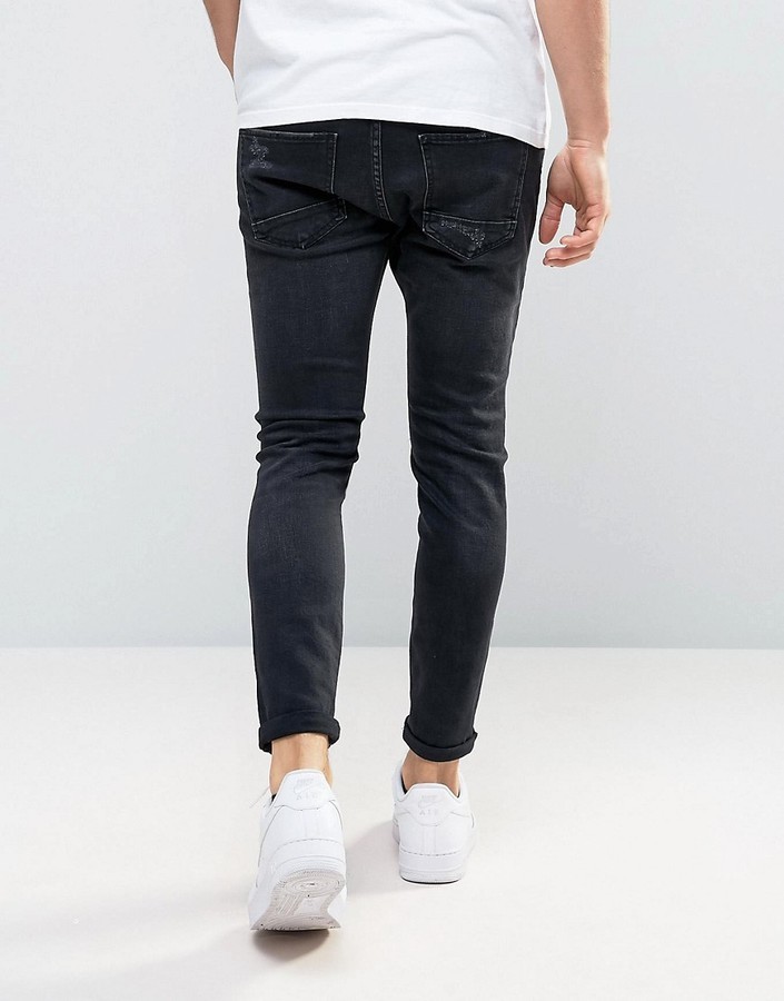 Pull&Bear Skinny Carrot Fit Jeans With Rip And Repair In Black, $64 | Asos | Lookastic