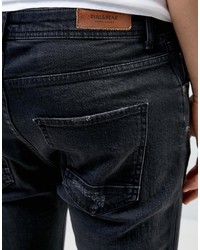 Pull&Bear Skinny Carrot Fit Jeans With Rip And Repair Detail In Black