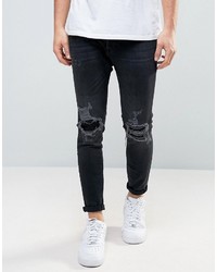 Pull&Bear Skinny Carrot Fit Jeans With Rip And Repair Detail In Black