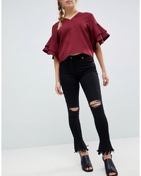 Parisian Skinny Jeans With Knee Rips And Distressed Flare Hem