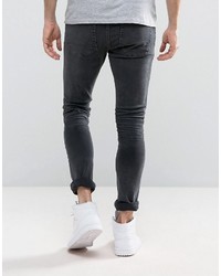Asos Super Skinny Jeans In Washed Black With Heavy Rips
