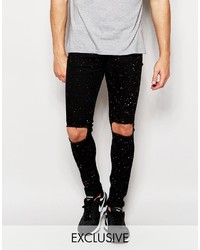 Reclaimed Vintage Super Skinny Jeans With Knee Rips And Paint Splatter