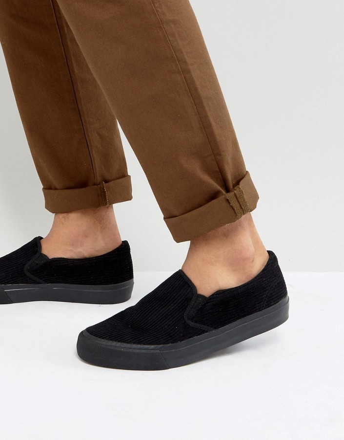 black slip on sneakers with black soles