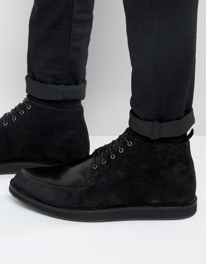 black leather and suede boots
