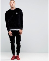 Religion Jersey Joggers In Slim Fit With Metal Badge And Zip Cuff