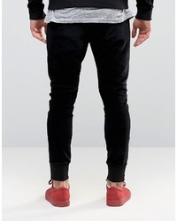 Religion Jersey Joggers In Slim Fit With Metal Badge And Zip Cuff