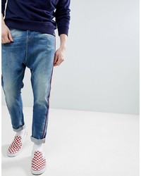 ASOS DESIGN Drop Crotch Jeans In Mid Wash Neppy Blue With Red Piping