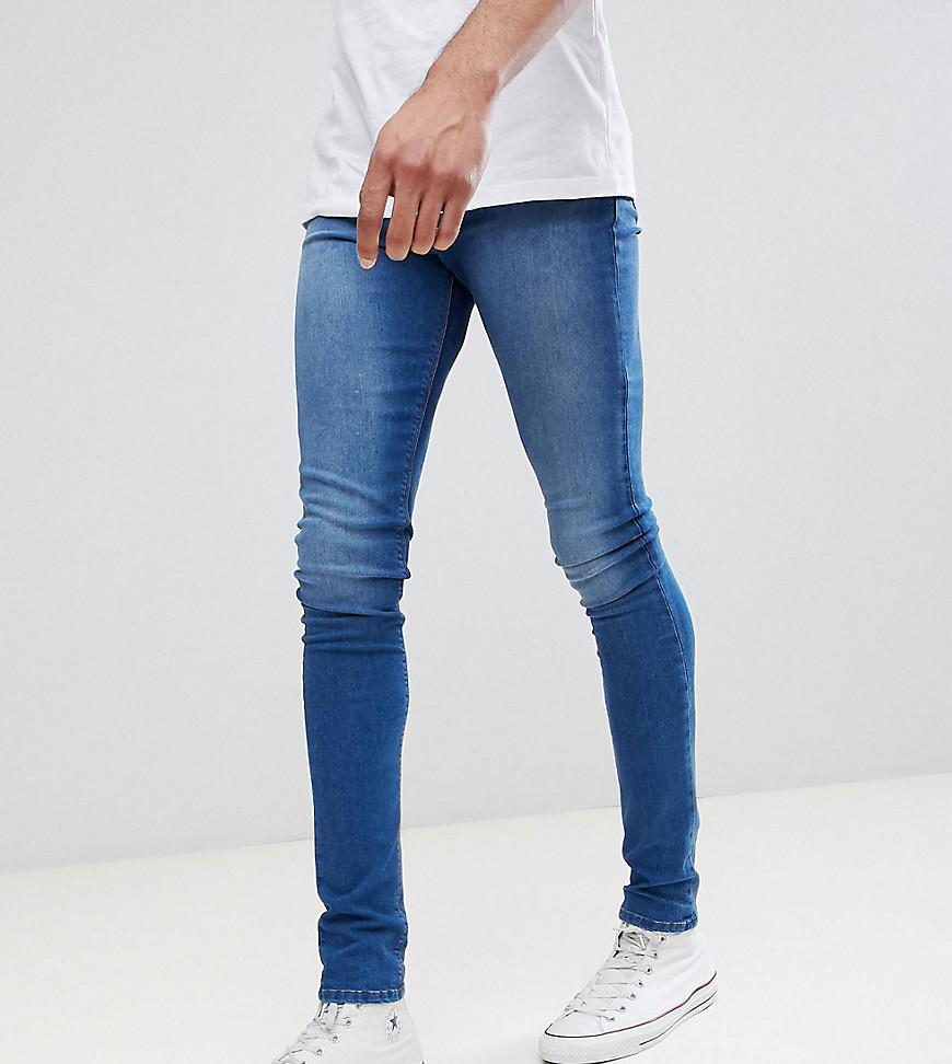 ASOS DESIGN Tall Super Spray On Jeans In Mid Blue, $16 | Asos | Lookastic