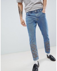 ASOS DESIGN Slim Jeans In Mid Wash Blue With Snake Print
