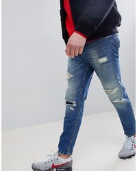 ASOS DESIGN Asos Tapered Jeans In Mid Wash Blue With Rips