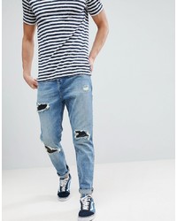 ASOS DESIGN Asos Tapered Jeans In Mid Wash Vintage With Faux Leather Rip Repair