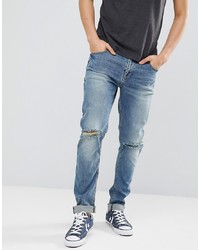 ASOS DESIGN Skinny Jeans In Mid Wash With Knee Rips