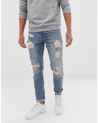 ASOS DESIGN Slim Jeans In Vintage Light Wash Blue With Heavy Rips