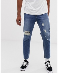 Collusion X003 Tapered Jeans With Knee Rips In Mid Wash