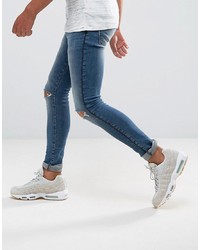 ASOS DESIGN Asos Extreme Super Skinny Jeans In Mid Wash With Rips And