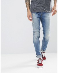 ASOS DESIGN Asos Super Skinny Jeans In Mid Wash Blue With Abrasions