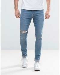ASOS DESIGN Asos Super Skinny Jeans With Thigh Rip In Mid Blue