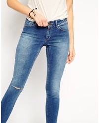 Asos Collection Lisbon Skinny Mid Rise Jeans In Worker Mid Wash Blue With Ripped Knee
