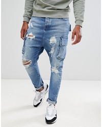 ASOS DESIGN Drop Crotch Jeans In Mid Wash Blue With Cargo Pockets And Rips