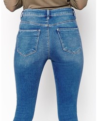 Asos Ridley Jeans Ridley Skinny Jeans In Putsborough Midwash Blue With Thigh Rips