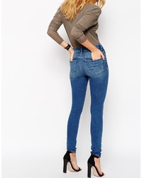 Asos Ridley Jeans Ridley Skinny Jeans In Putsborough Midwash Blue With Thigh Rips