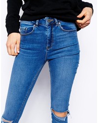 Asos Ridley Skinny Jeans In Busted Mid Wash Blue With Busted Knees