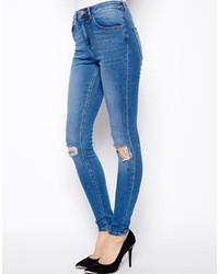 Asos Ridley Skinny Jeans In Busted Mid Wash Blue With Busted Knees