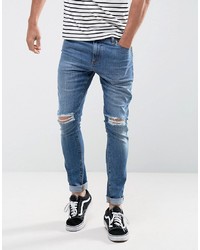 ASOS DESIGN Super Skinny Jeans In 125oz Mid Wash Blue With Knee Rips