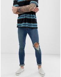 ASOS DESIGN Super Skinny Jeans In Mid Wash Blue With Open Knee Rip