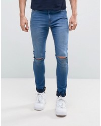 ASOS DESIGN Super Spray On Jeans With Knee Rips In Mid Blue