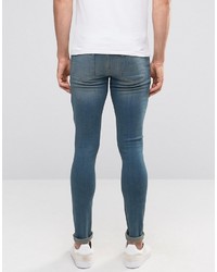 Asos Extreme Super Skinny Jeans With Knee Rips In Mid Wash