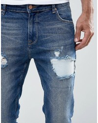 Asos Skinny Jeans In Mid Wash Blue With Rip And Repair