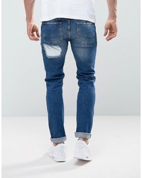Asos Skinny Jeans In Mid Wash Blue With Rip And Repair