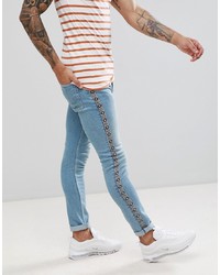 ASOS DESIGN Super Skinny Jeans In Light Wash Blue With Abrasions With Aztec