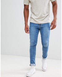ASOS DESIGN Super Skinny Jeans In Mid Blue