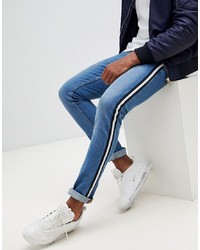 ASOS DESIGN Super Skinny Jeans In Mid Wash Blue With