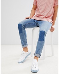 ASOS DESIGN Super Skinny Jeans In Vintage Mid Wash With Rip And Repair