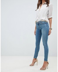 ASOS DESIGN Whitby Low Waist Skinny Jeans In Mid Stonewash Blue